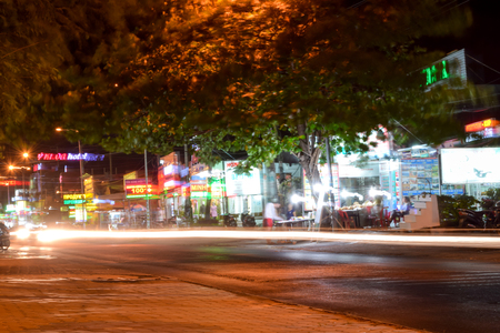 Vietnam, Mui Ne - 28 March 2017. View of the night city street life. Photo taken with long exposureのeditorial素材