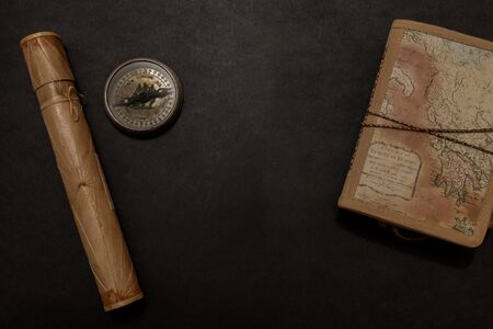 Travel notes on dark background with free space of the open bookの写真素材