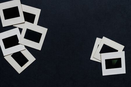 Vintage blank photo slides on black background with free spaceの写真素材