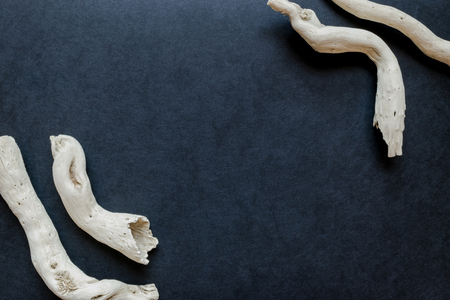 Old and white sticks formation on the black background surface with free spaceの写真素材