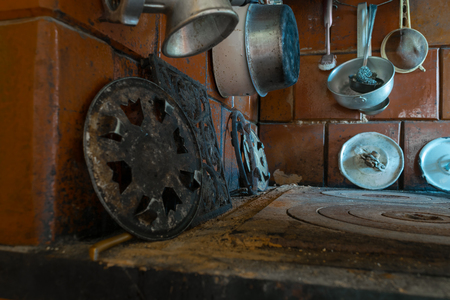 Top view of rural stove with a lot of old kitchen toolsの写真素材