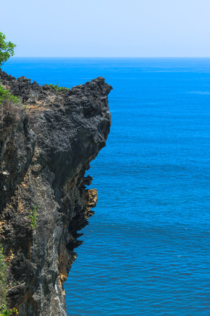 Landscape of cliff and Indian ocean in Bali island, Indonesiaの写真素材