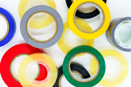 Various colors round adhesive tapes on white background surfaceの写真素材