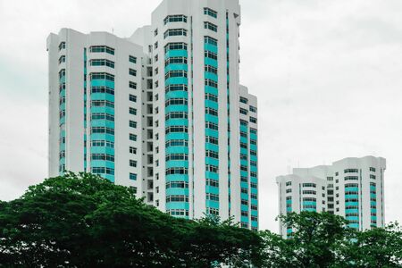 Singapore - 14 OCT 2018. White with blue balconies apartment block during cloudy dayのeditorial素材