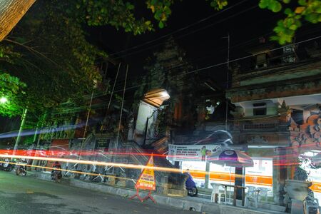 Bali, Indonesia 4 OCT 2018. Nightlife street in Bali with old temple in backgroundのeditorial素材
