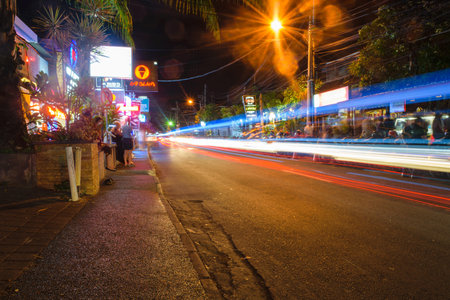 Bali, Indonesia 12 OCT 2018. Nightlife street in Bali with bars in backgroundのeditorial素材