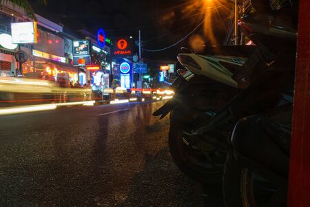 Bali, Indonesia 12 OCT 2018. Nightlife street in Bali with bars in backgroundのeditorial素材