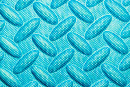 Light blue background of soft foam rubber with pattern
