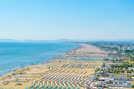 Aerial view of Rimini resort beach in Italy with a lot of parasols and sunbeds during summer timeの写真素材
