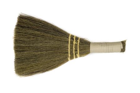 Top view of decorative straw broom on white background with copy spaceの写真素材
