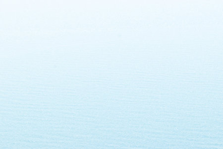 Crystal clear view of very bright and calm blue sea water background during very sunny dayの写真素材