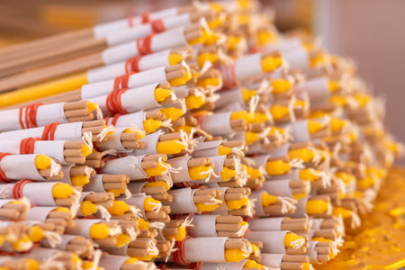 Background view of sacrificial and ceremony sets made from candles and incense wrapped in paper in...