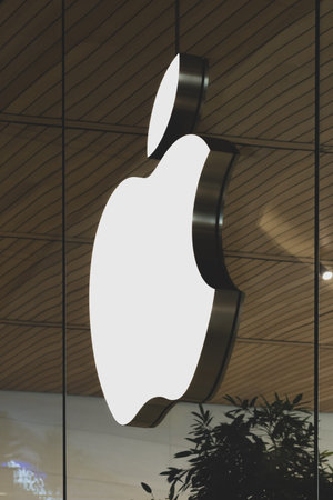 Thailand Bangkok 16 MAR 2020 Technology company Apple white sign logo hanging on the glass window....