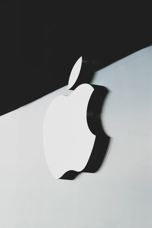 Thailand Bangkok 16 MAR 2020 Technology company Apple sign logo hanging on the white and black matte glass window. Spots and window frames taken away in post production processのeditorial素材