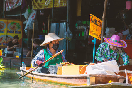 Thailand Bangkok 4 MAR 2020 Travel and leisure concept. Salesman selling goods in floating market....