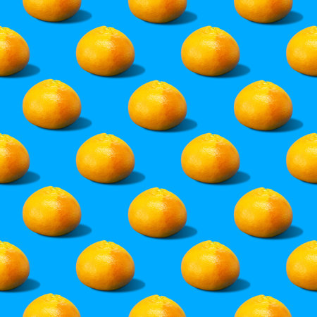 Colorful and summer time background pattern illustration of yellow fresh grapefruits casting hard...