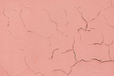Abstract grunge pink wall with cracks background with copy spaceの写真素材