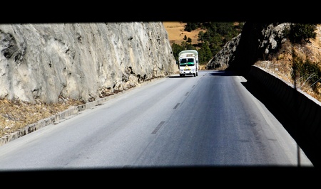 Truck on the road in the mountainの写真素材
