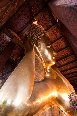 Side view of reclining buddha statue in Bangkok of Thailandのeditorial素材