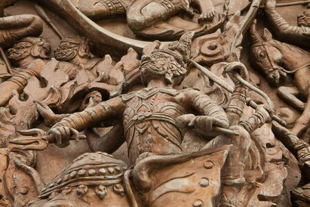 Close up of wall sculpture in Trimit temple of Bangkok, Thailandの写真素材