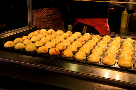 Takoyaki cooking in shop of Japanの写真素材
