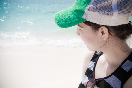 Beach travel - woman seeing the nature of oceanclose upの写真素材