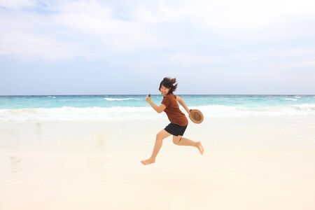 Woman - travel and running on the beachの写真素材