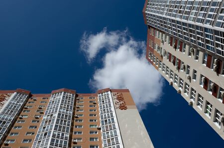 Kyiv, Ukraine - September 17, 2019. Gmyry street. Modern residential high-rise buildings against a blue sky. Urban background. Urban sprawl concept.のeditorial素材