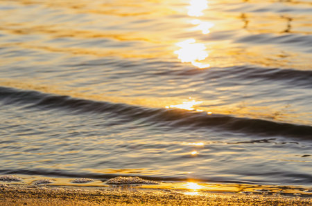 Beautiful sunset over the river. The solar path on the surface of the water. Reflection of the...