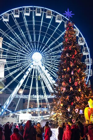 Kyiv, Ukraine - January 3, 2020. Kontraktova Square. Christmas Tree, Ferris Wheel, traditional Christmas fair on Podil. Concept of holidays and festivitiesのeditorial素材