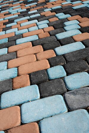 Multi-colored paving slabs. Abstract textured background. Vertical orientationの写真素材