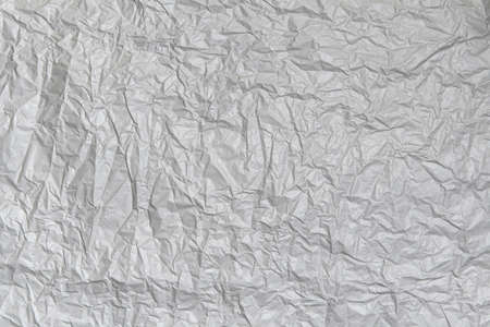 Crumpled gray paper texture. Abstract blank background for designの写真素材