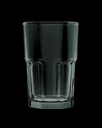 Empty faceted glass isolated on black background. Closeupの写真素材