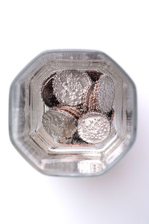 Coin at the bottom of glass with sodaの写真素材