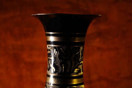 Vintage vase on wood background (focus on vase).の写真素材
