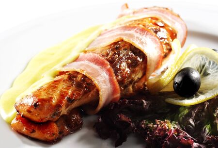 Salmon Steak in Bacon with Lemon Sauce. Isolated on White Backgroundの写真素材