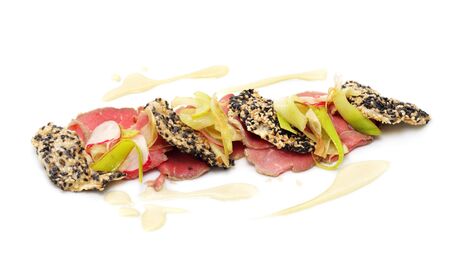 Veals Sashimi with Wasabi and Celery Chips over White Backgroundの写真素材