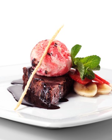 Dark Chocolate Pie with Berries Ice Cream and Fresh Mint and Fruit. Isolated on White Backgroundの写真素材