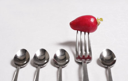 Spoon and Fork with Fresh Radishの写真素材