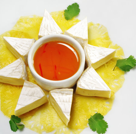 Appetizer - Camembert on a Pineapple Carpaccio with Honey Sauceの写真素材