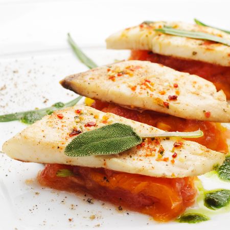 BBQ Fillet of Fish with Vegetables and Greensの写真素材