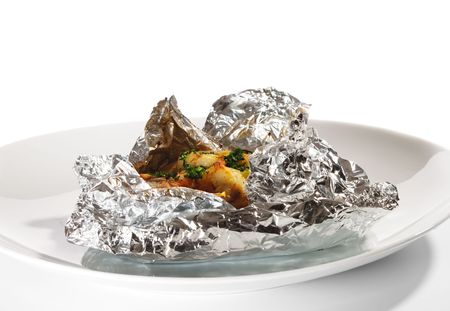 Baked Fillet of Fish in Foil with Vegetablesの写真素材