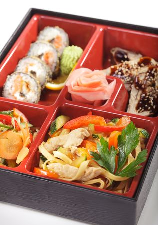 Japanese Bento Lunch - Salad with Cold Eel Appetizers and Hot Rollの写真素材