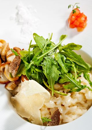 Risotto with Rucola, Tartufo Bianco (White Truffle) and Porcini and Tomatoの写真素材