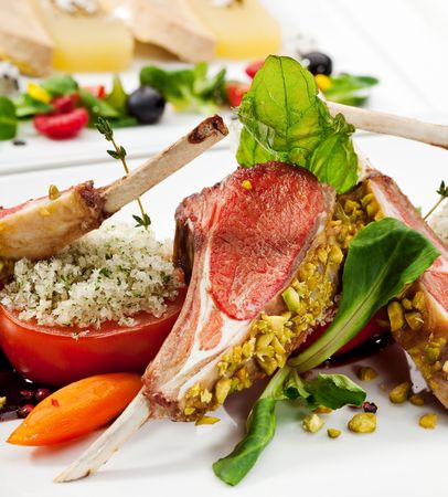 Roasted Lamb Chops with Pistachio. Garnished with Vegetables and Basilの写真素材