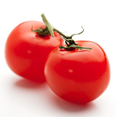 Cherry Tomato Isolated over Whiteの写真素材