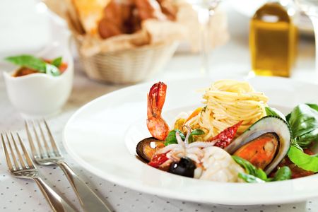Seafood Spaghetti with Tiger Prawns, Scallops, Mussels, Calamari, Salmon and Tomato Sauceの写真素材