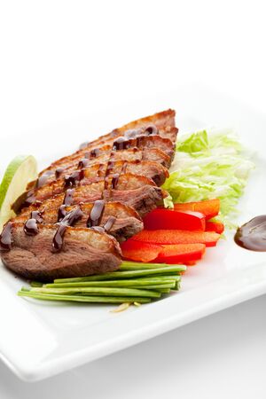 Roasted Breast in Sesame Sauce with Vegetables and Limeの写真素材