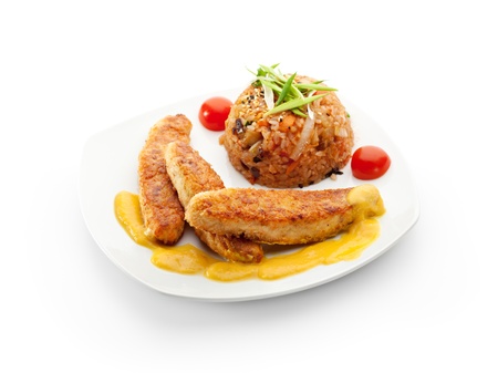 Deep Fried Fish Sticks with Coconut Sauce  Garnished with Rice and Vegetablesの写真素材