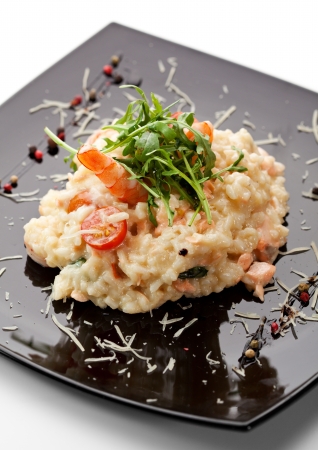 Risotto with Salmon, Tiger Prawns and Cherry Tomatoesの写真素材
